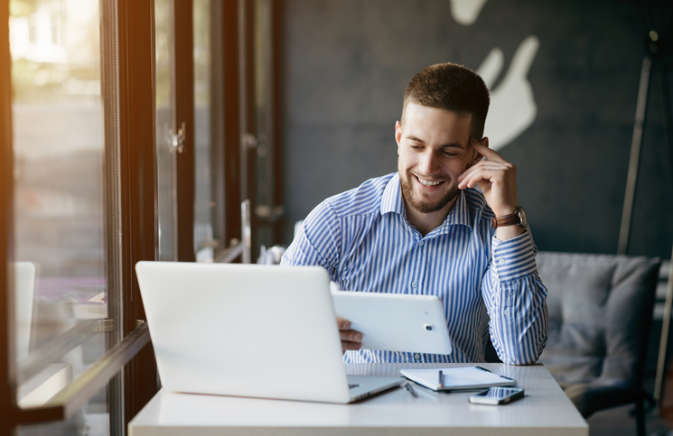 Business owner taking his business online Business owner taking his business online