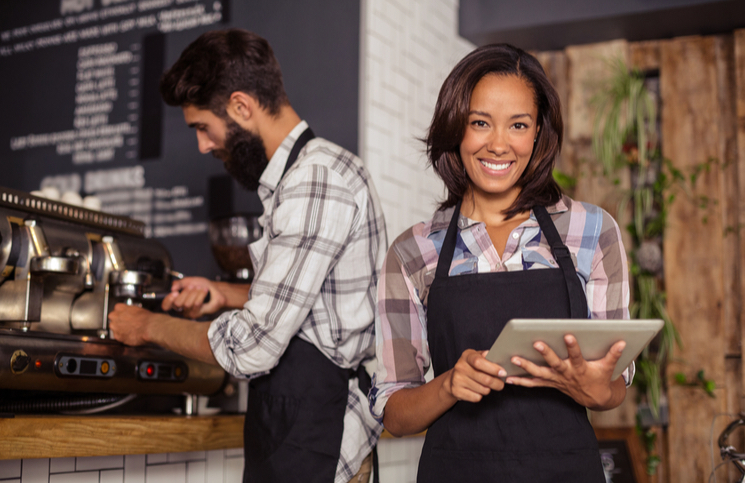 Restaurant Business workers using digital tools in a tablet Restaurant Business workers using digital tools in a tablet