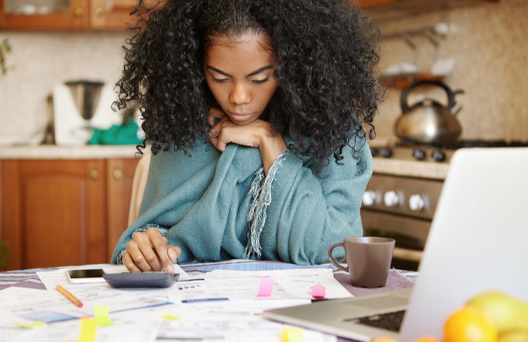 Woman business owner doing her finances Woman business owner doing her finances