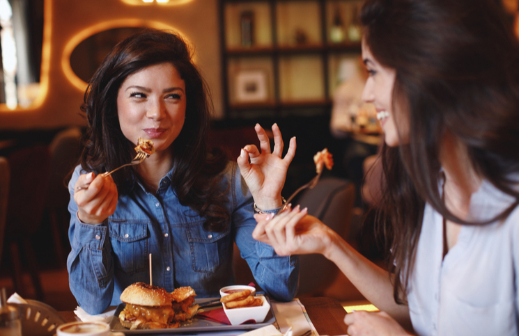 Friends living a great experience in a restaurant Friends living a great experience in a restaurant