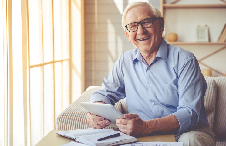 Old man entrepreneur starting his own business at home