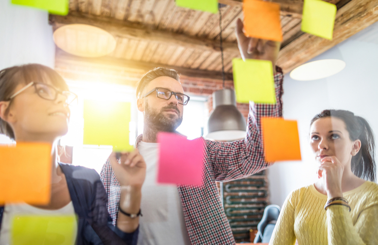 A team brainstorming ideas using post-its
