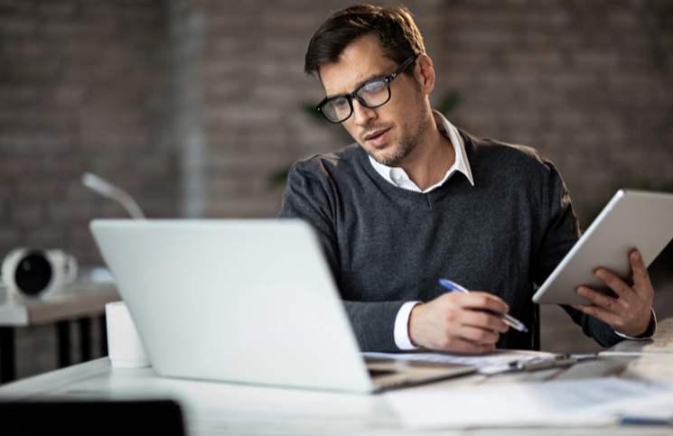 Businessman looking for ways to improve customer acquisition Businessman looking for ways to improve customer acquisition
